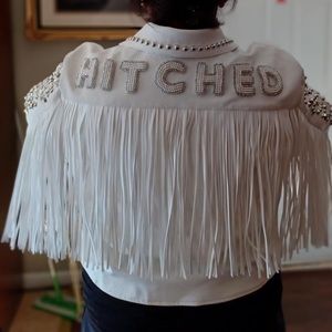 White leather studded and fringe leather jacket